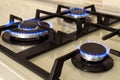 Closeup shot of blue fire from domestic kitchen stove top. Gas c Royalty Free Stock Photo