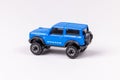 Closeup shot of a blue Hot Wheels Ford Bronco isolated on a white background