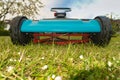 Closeup shot of a blue lawn mower