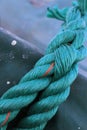 A closeup shot of a blue rope on a ship Royalty Free Stock Photo