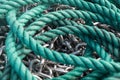 Closeup shot of a blue tight rope and a silver metal chain Royalty Free Stock Photo