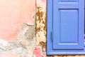 Closeup shot of a blue window shutter on a shabby wall Royalty Free Stock Photo