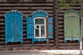 Closeup shot of blue windows of a traditional wooden house in Tomsk, Russia