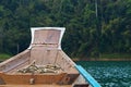 Closeup shot of a boat getting ready to sial in the river surrounded by a forest Royalty Free Stock Photo
