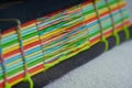 Closeup shot of a book with colorful paper bound with woven thread Royalty Free Stock Photo