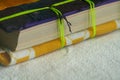 Closeup shot of a book with paper sheets bound with green thread Royalty Free Stock Photo