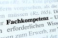 Closeup shot from the book of the word 'Fachkompetenz' translated as professional competence