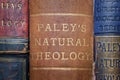 Closeup shot of the book "Natural Theology" by William Paley on a shelve