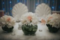 Closeup shot of bottles with white roses on a table at a wedding n Sarajevo, Bosnia and Herzegovina Royalty Free Stock Photo