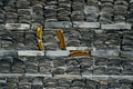 Closeup shot of a brick wall with a tile - perfcet for a cool background