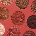 Closeup shot of broken multicolor eyeshadow as samples of cosmetic beauty product