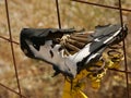 Closeup shot of the broken seat of a bicycle