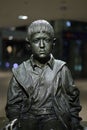 Closeup shot of the bronze child transports statue sitting at Vienna train Station