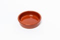 Closeup shot of a brown clay plate isolated on a white background Royalty Free Stock Photo