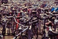 Closeup shot of bunch of bicycles parked in a main station of Amsterdam, Netherlands Royalty Free Stock Photo