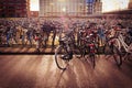 Closeup shot of bunch of bicycles parked in a main station of Amsterdam, Netherlands Royalty Free Stock Photo