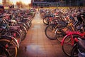 Closeup shot of bunch of bicycles parked in a main station of Amsterdam, Netherlands Royalty Free Stock Photo