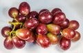 Closeup shot of a bunch of fresh red grapes isolated on a white background Royalty Free Stock Photo