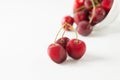 Closeup shot of a bunch of sweet cherries isolated on a white background