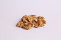 Closeup shot of a bunch of walnuts on a white background