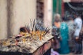 Closeup shot of burning incense sticks to show respect to the Gods at a Hindu temple