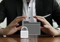 Closeup shot of a businessman protecting a secured folder with his hands