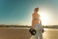 Closeup shot of butts with dumbbells. Athletic girl doing a fitness workout with weights. Woman working out with Royalty Free Stock Photo