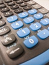 Closeup shot of a calculator with blue and black buttons Royalty Free Stock Photo