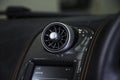 Closeup shot of car aircon on a black dashboard in a car