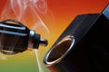 Closeup shot of a car cigarette lighter on a colorful background Royalty Free Stock Photo