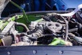 Closeup shot of a car's opened hood with engine and other parts Royalty Free Stock Photo