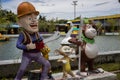 Closeup shot of cartoon characters in front of a lake at an amusement park in Kota Kinabalu