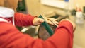 Closeup shot of a Caucasian barber cutting his client& x27;s hair.