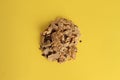 Closeup shot of cereals with chocolate chips on a yellow surface Royalty Free Stock Photo