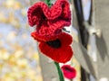 Closeup shot of a chain of knitted poppies