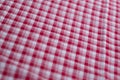 Closeup shot of checkered texture in pink and white colors