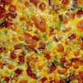 Closeup shot of a cheesy pizza filled with different toppings