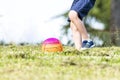 Closeup shot of a child playing ball in the garden Royalty Free Stock Photo