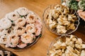 Closeup shot of chocolate candies with nuts in decorative flower buds Royalty Free Stock Photo