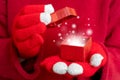 Closeup shot of the Christmas gift box. Festive composition. Red background