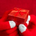Closeup shot of the Christmas gift box. Festive composition. Red background