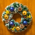 Closeup shot of Christmas ornamental wreath hanging on a wall