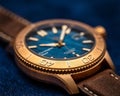 Closeup shot of Christopher Ward C60 Trident Bronze Watch on blue background