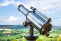 Closeup shot of a city telescope on a scenic natural background Royalty Free Stock Photo