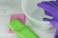 Closeup shot of cleaning, rubber gloves, bucket, sponge, and cleaning rag