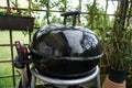 Closeup shot of a closed charcoal grill with raindrops Royalty Free Stock Photo