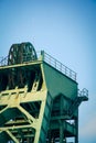 Closeup shot of a coal mining equipment under a blue sky outdoors Royalty Free Stock Photo