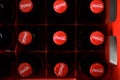 Closeup shot of coca-cola bottles in a box