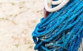 Closeup shot of coiled rope and sand