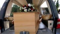 Colorful casket in a hearse or chapel before funeral or burial at cemetery